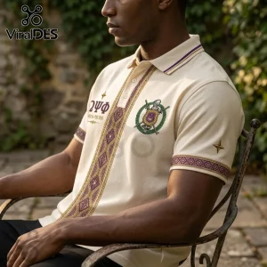 Premium Omega Psi Phi Cream Polo Shirt with embroidered fraternity crest, gold geometric patterns, and purple collar detail.