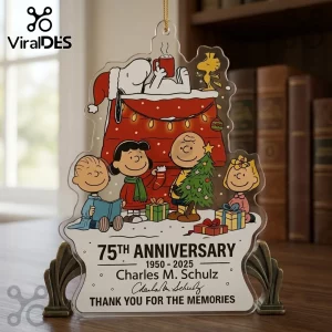 Peanuts Snoopy 75th Anniversary Christmas Ornament featuring the Peanuts gang, a festive fireplace, and commemorative text.