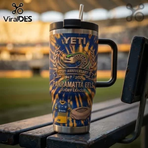 Parramatta Eels 79th Anniversary 40oz Tumbler with blue and yellow tie-dye print, team logo, and stadium graphic on a bench.