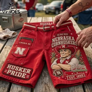 Nebraska Cornhuskers Mascot Red Casual Shorts featuring screen-printed graphics, side utility pockets, and a woven belt.