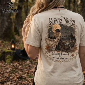 Stevie Nicks Velvet Shadows Beige T-Shirt featuring a graphic of a woman, a vintage car, moon, and text in a forest setting.