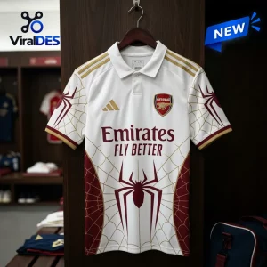 Front view of an Arsenal FC x Spider-Man white polo shirt hanging on a wooden hanger with red and gold details.