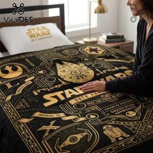 Star Wars 50th Anniversary Millennium Falcon duvet set in black and gold with iconic film symbols on a bedroom bed.