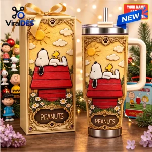 Custom Snoopy Peanuts Stanley Tumbler featuring Snoopy and Woodstock on a red doghouse with floral gold embossed details.