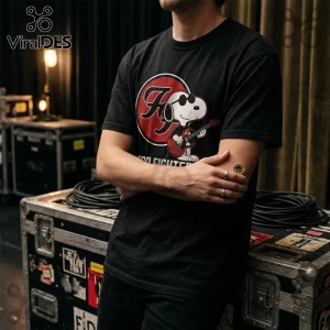 Foo Fighters x Snoopy One By One Shirt featuring Snoopy with sunglasses playing a red guitar over a red and white FF logo.