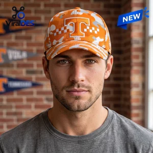 Front view of a man wearing a Tennessee Volunteers Orange Camo Classic Cap against a brick wall.
