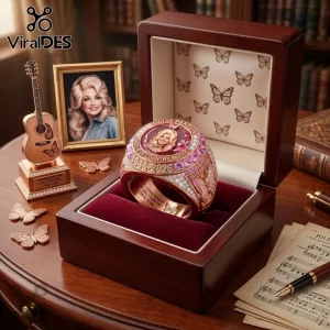 Dolly Parton 1946-2026 Rose Gold Tribute Ring featuring a portrait, butterfly motifs, and an elegant wooden display box.