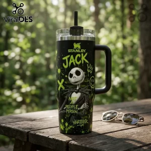 Jack Skellington Not A People Person black 40oz tumbler with neon green graffiti-style accents on a wooden outdoor table.