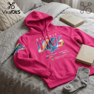 Detroit Lions NFL Crucial Catch pink pullover hoodie with multi-colored team lettering and intercept cancer logo.