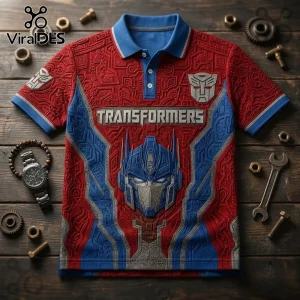 Optimus Prime Cyber Robot Red and Blue Polo Shirt with detailed circuit board patterns and Autobot logo on wooden table.