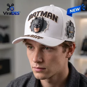 Front view of a person wearing a Batman The Dark Knight white baseball cap with 3D character graphics.