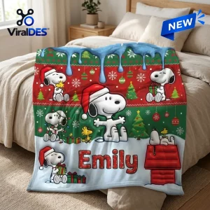 Personalized Snoopy Christmas fleece blanket featuring Snoopy and Woodstock on a red and green festive holiday background.
