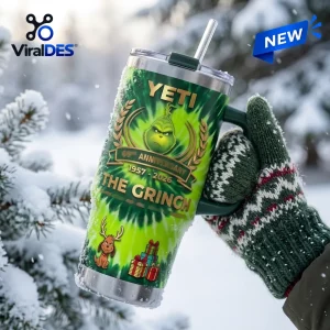 Close-up view of the Yeti The Grinch 69th Anniversary Handle Tumbler held in a winter setting.