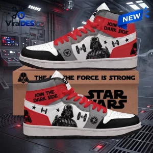 Side view of high top sneakers featuring black, white, and red panels with themed character graphics and red laces.
