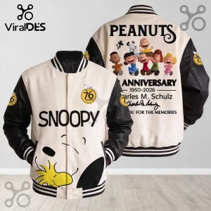 Peanuts Snoopy 76th Anniversary Baseball Jacket with cream body, black sleeves, and Peanuts character graphic prints.