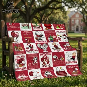 Oklahoma Sooners Snoopy Peanuts Christmas fleece blanket draped on a park bench featuring team logos and holiday graphics.