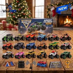 Front view of Monster Jam Advent Calendar 2026 box with toy monster trucks and accessories on a wooden table.