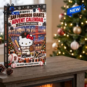 Front view of a Hello Kitty x San Francisco Giants advent calendar box on a table in front of a holiday tree.