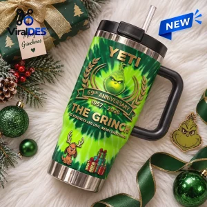 Front view of Yeti The Grinch 69th Anniversary Handle Tumbler on furry white surface.