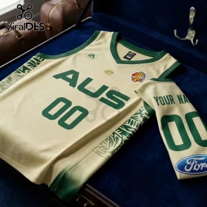 Australia Basketball 2026 FIBA Women World Cup cream jersey with green trim, 'AUS' text, and patterned side panels.