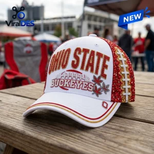 Front view of an Ohio State Buckeyes rhinestone white baseball cap sitting on a wooden table.