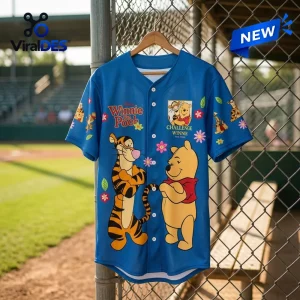 Disney Winnie the Pooh Blue Baseball Jersey featuring Tigger and Winnie the Pooh character graphics on a chain link fence.