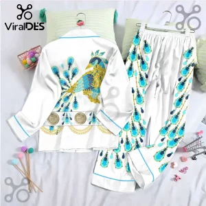 Elvis Presley Peacock Satin Pajama Set featuring white fabric, blue and gold peacock motif, and gold chain print accents.