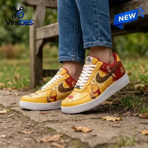 Winnie the Pooh Tigger Nike Air Force 1 Sneakers in yellow and red featuring honeycomb patterns and character illustrations.