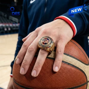 USA Basketball FIBA Women's World Cup 2026 Ring in gold with red, white, and blue center emblem resting on a basketball.