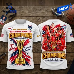 USA Women's Basketball 2026 World Cup Champions shirt featuring team photos, championship trophy, and patriotic red-blue graphics.