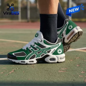 Side view of Panathinaikos BC green personalized Air Max Plus sneakers worn on a basketball court.