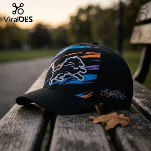 Detroit Lions NFL Crucial Catch Black Hat featuring a white team logo, multicolor brushstroke details, and side embroidery.