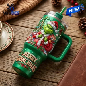 Angled view of Grinch Merry Grinchmas 40oz Tumbler in green with festive character art and handle.