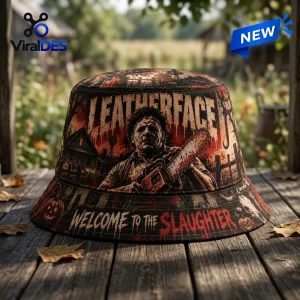 Front view of Leatherface Welcome To The Slaughter Horror Bucket Hat on wooden surface.