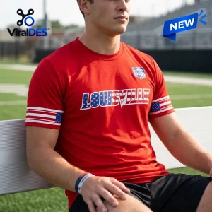 Louisville Cardinals Salute to Service 2026 shirt featuring a red crewneck, USA 250 shield, and flag-patterned sleeves.