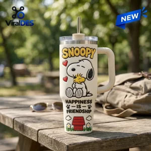 Front view of an off-white tumbler featuring a dog character illustration and text that reads Happiness Is Friendship.