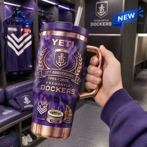Fremantle Dockers 32nd Anniversary Stanley Tumbler featuring purple textured finish, gold trim, and team anchor logo emblem.