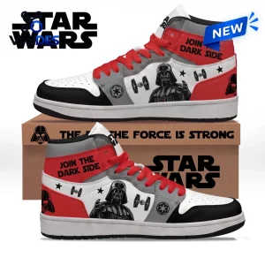 Side view of high top sneakers featuring black, white, and red panels with helmet graphics and spaceship icons.