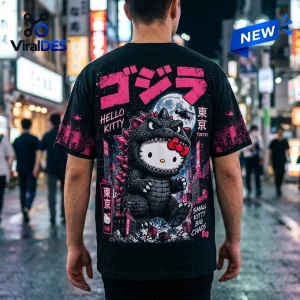 Back view of a black t-shirt featuring a character wearing a monster costume in a neon Tokyo city graphic.