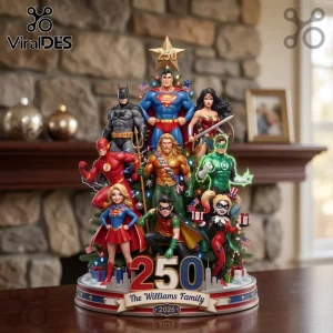 Justice League 2026 Superhero Christmas Tree Ornament featuring Superman, Batman, Wonder Woman, and friends on a display base.