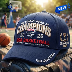USA Basketball 2026 World Cup Champions navy baseball cap with embroidered lettering and a tournament trophy graphic.