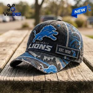 Front view of a distressed Detroit Lions NFL baseball cap resting on a weathered wooden surface.