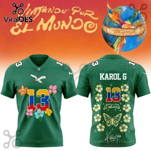 Karol G Tropitour Colombia floral football jersey in green with number 13, hibiscus patterns, and butterfly motifs.