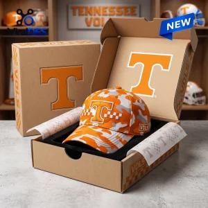 Front view of a Tennessee Volunteers Orange Camo Classic Cap displayed inside branded packaging.