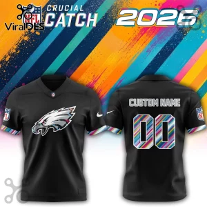 Philadelphia Eagles 2026 Crucial Catch black football jersey showing front and back views with multicolor striped trim.