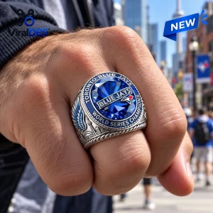 Closeup of a Toronto Blue Jays World Series Champions Ring on a clenched fist outdoors.