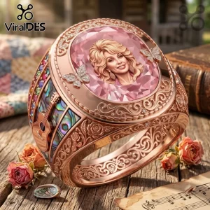 Dolly Parton 1946-2026 Rose Gold Ring with a portrait center, butterfly accents, and guitar side motifs.