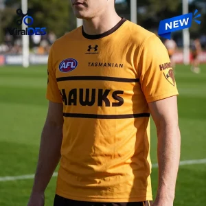 Hawthorn Football Club Gold Performance T-Shirt with black horizontal stripes, Under Armour logo, and AFL branding.