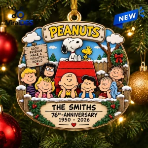 Peanuts 76th Anniversary Christmas ornament featuring Snoopy, Charlie Brown, and the gang with a custom family name plaque.