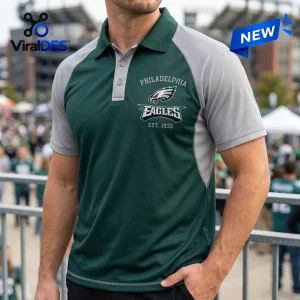 Philadelphia Eagles Two Tone Performance Polo Shirt in midnight green and gray with team logo and established date text.